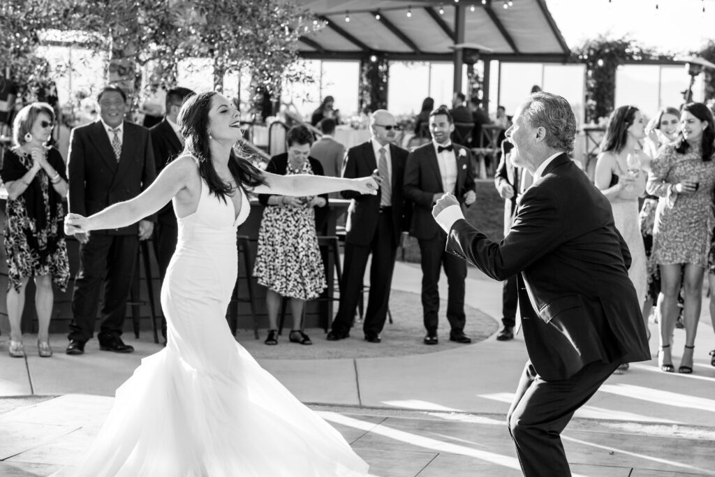 Father of the bride and bride have a fun dance together
