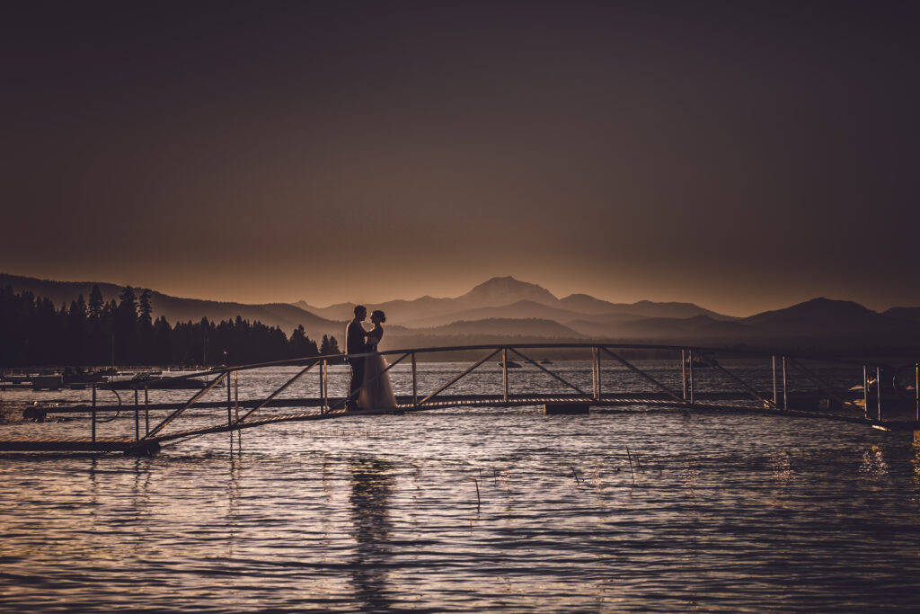 Golden Hour Bride and Groom on the Lake Portrait.  It's always a great idea to save a couple minutes to photograph sunset wedding pictures