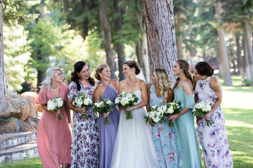 Gorgeous floral  prints and different color bridesmaids dresses make for  modern, yet classic, traditional, fun bridal party pictures