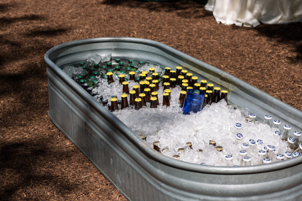 cold drinks for everyone at cocktail hour.  Cleverly presented and styled in horse troughs instead of coolers