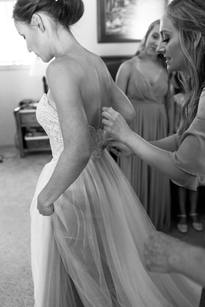 Moments captured while the bride is getting ready with her bridesmaids
