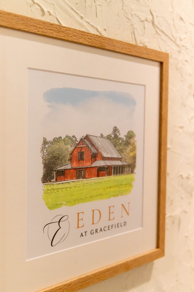 Eden at Gracefield artwork displayed on the wall in the barn reception 