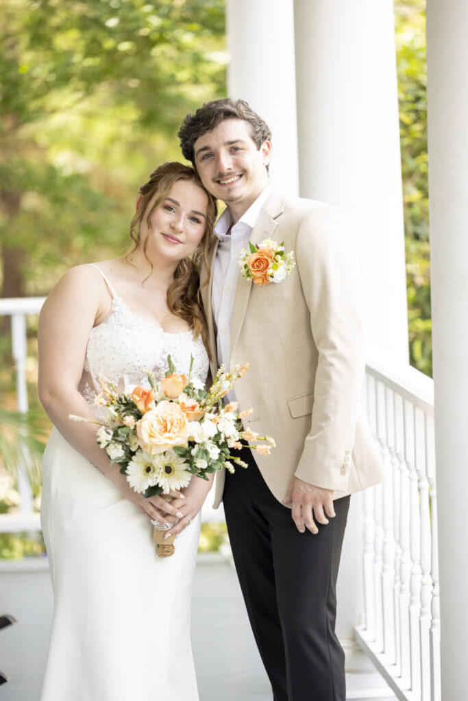 Bride and groom portrait on the front porch at the Twelve Oak Estate in Lexington SC