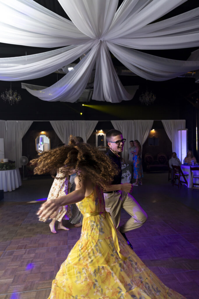 Fun photo of guests dancing at a wedding at the Twelve Oak Estate Kevin Snow keeps the party moving
